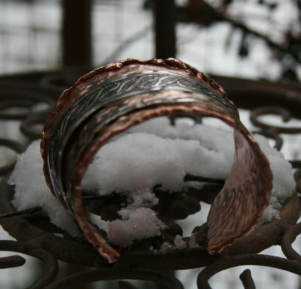 keltische Armspange aus Kupfer mit Silberverziehrung